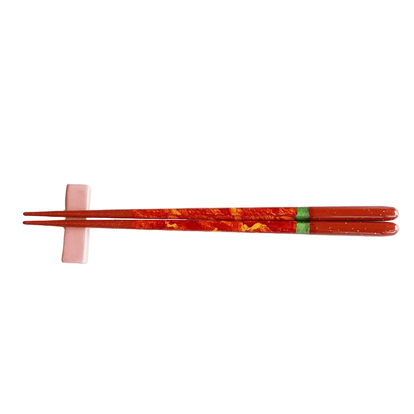 Red chopsticks with chopstick rests
