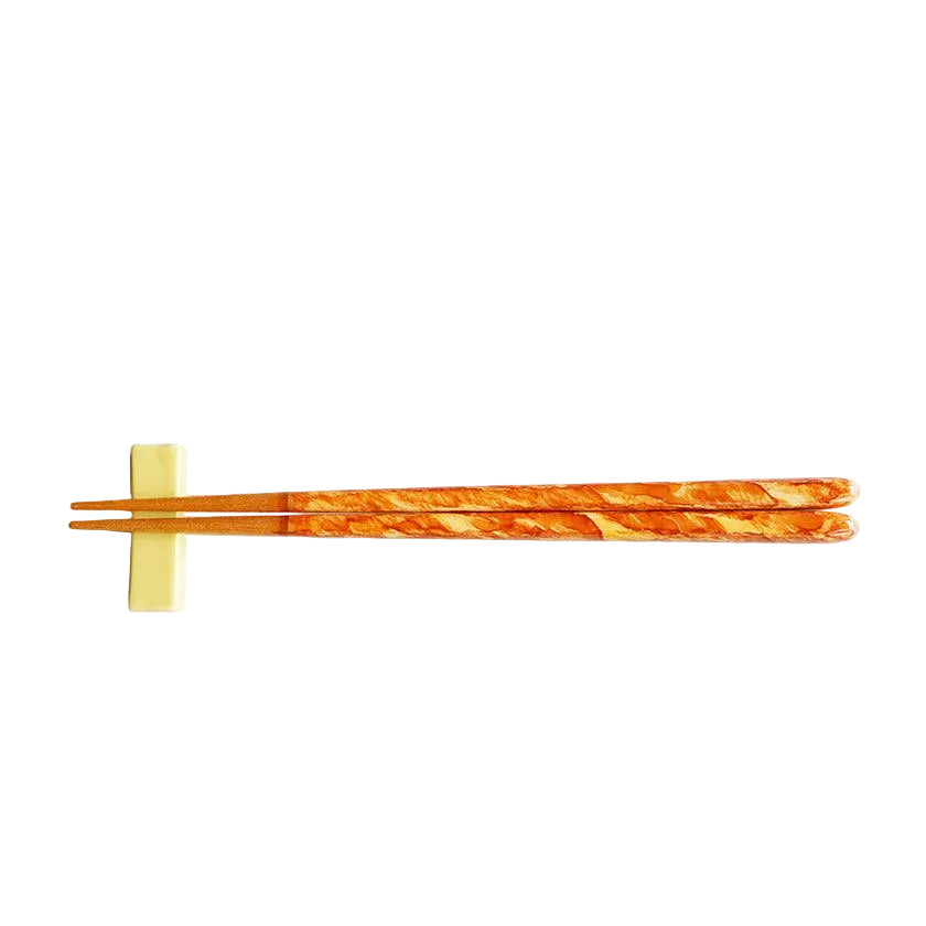 Orange chopsticks with chopstick rest