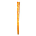 Orange chopsticks with chopstick rest
